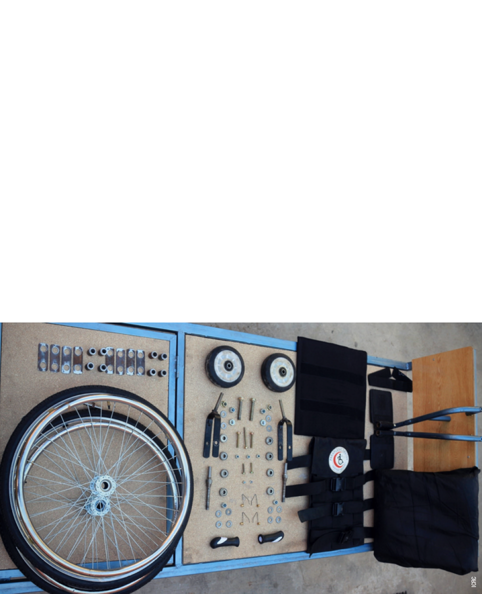 ICRC,Wheels of innovation at Peshawar paraplegic centre Work goes on at hectic pace as eight people stand on either s   